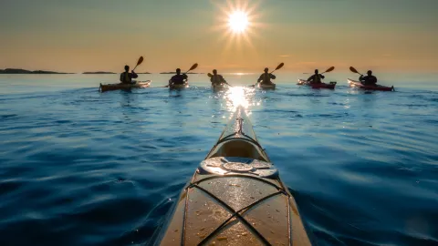 Kayaking outside Hamn midnight sun