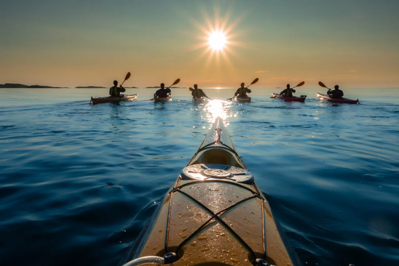 Kayaking outside Hamn midnight sun